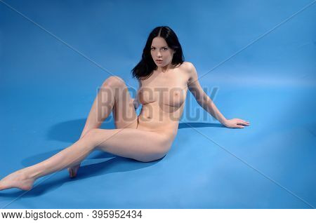 Beautiful Sexy Woman Nude Showing Breasts Naked And Nipples Complete Nude In Blue Background