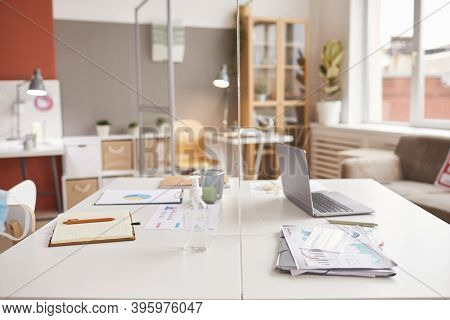 Background Image Of Two Office Desks Separated By Glass Pane At Post Pandemic Workplace, Copy Space