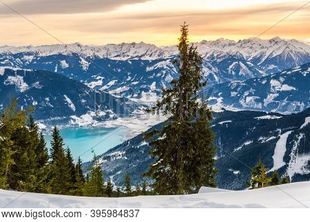 Zell Am See And Schmitten Town At Zeller Lake In Winter. View From Schmittenhohe Mountain, Snowy Ski