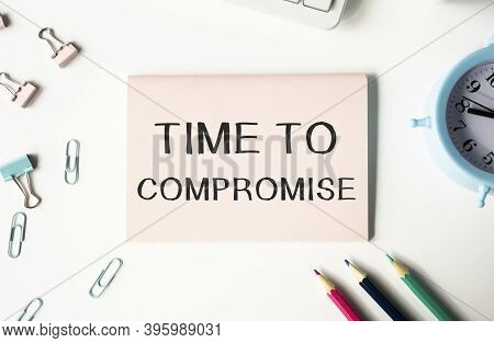 Text Time To Compromise Written On Notepad With Calculator, Pensil, Magnifier And Dollars. Business 