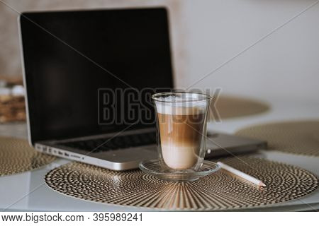 Notepad, Laptop And Coffee Cup On Wood Table. View From Above