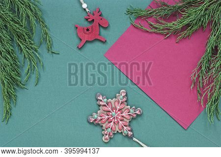 Holiday Flat Lay With Traditional Christmas Ornaments In Green And Red Colors
