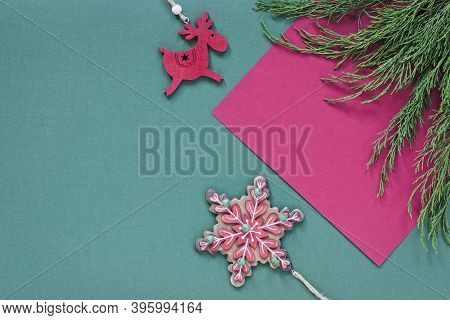 Flat Lay With Traditional Christmas Ornaments In Green And Red With Copy Space