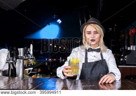 Experienced Girl Bartender Makes A Cocktail At Bar