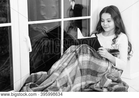 Carried Away Into World Of Fantasy. Small Girl Read Fantasy Book On Windowsill. Little Child Enjoy R