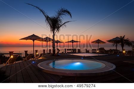 Summer Time: Beautiful Dawn At Pool Area With Palm And Parasols, Tropea, Italy