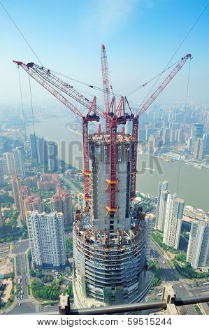 SHANGHAI, CHINA - JUNE 2: Skyscraper under construction on JUNE 2, 2012 in Shanghai, China. Shanghai is the largest city by population in the world with 23 million as in 2010 and is still growing.