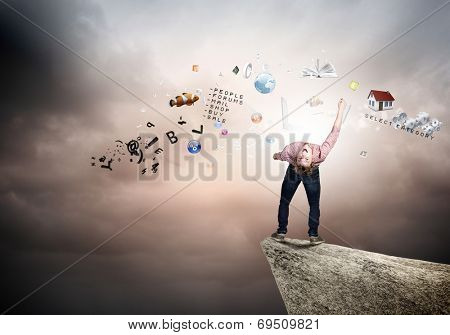 Young man in casual evading from flying icons
