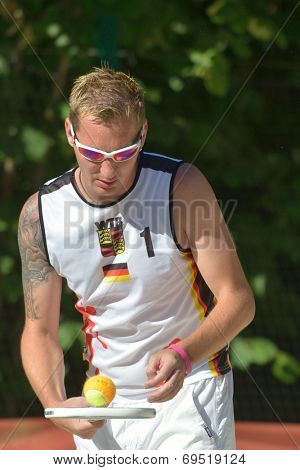 MOSCOW, RUSSIA - JULY 19, 2014: Alexander Bailer of Germany in the match against Brazil during ITF Beach Tennis World Team Championship. Brazil won 2-1
