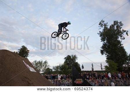 BONTIDA - JUNE 21: Unidentified BMX rider making a bike jump during the BMX Competition, at Electric Castle Festival on June 21, 2014 in the Banffy castle in Bontida, Romania
