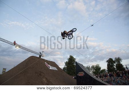 BONTIDA - JUNE 21: Unidentified BMX rider making a bike jump during the BMX Competition, at Electric Castle Festival on June 21, 2014 in the Banffy castle in Bontida, Romania