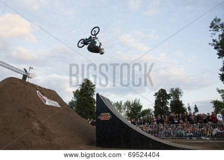 BONTIDA - JUNE 21: Unidentified BMX rider making a bike jump during the BMX Competition, at Electric Castle Festival on June 21, 2014 in the Banffy castle in Bontida, Romania
