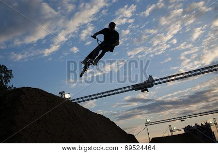 BONTIDA - JUNE 21: Unidentified BMX rider making a bike jump during the BMX Competition, at Electric Castle Festival on June 21, 2014 in the Banffy castle in Bontida, Romania