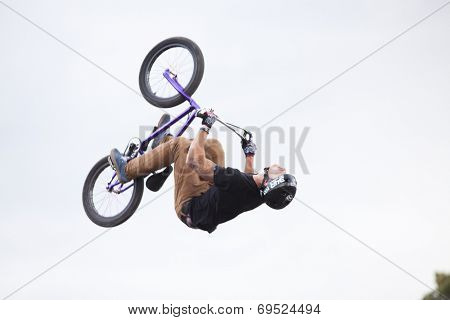 BONTIDA - JUNE 21: Unidentified BMX rider making a bike jump during the BMX Competition, at Electric Castle Festival on June 21, 2014 in the Banffy castle in Bontida, Romania