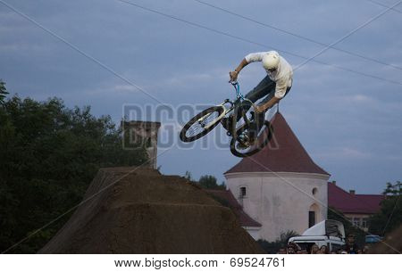 BONTIDA - JUNE 21: Unidentified BMX rider making a bike jump during the BMX Competition, at Electric Castle Festival on June 21, 2014 in the Banffy castle in Bontida, Romania