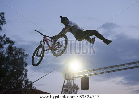 BONTIDA - JUNE 21: Unidentified BMX rider making a bike jump during the BMX Competition, at Electric Castle Festival on June 21, 2014 in the Banffy castle in Bontida, Romania