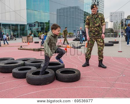 Kids Running Military Obstacle Course