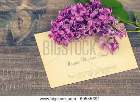 Lilac Flowers On Wooden Background
