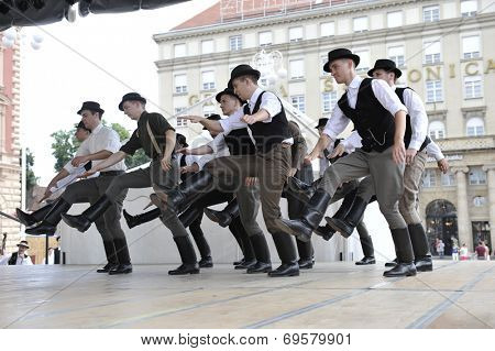 ZAGREB, CROATIA - JULY 19: Members of folk groups Nograd  from Salgotarjan, Hungary during the 48th International Folklore Festival in center of Zagreb, Croatia on July 19, 2014