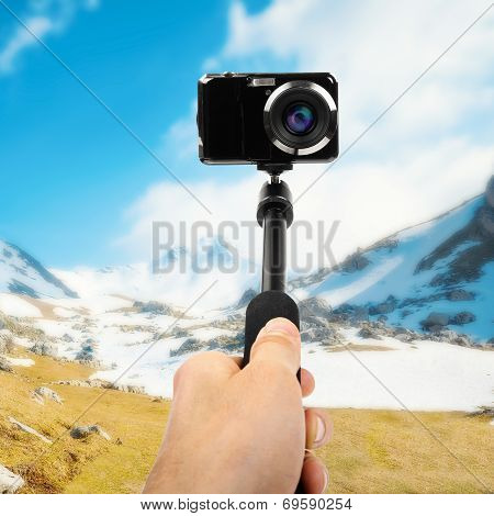 Taking Selfie - Hand Hold Monopod With Photo Camera
