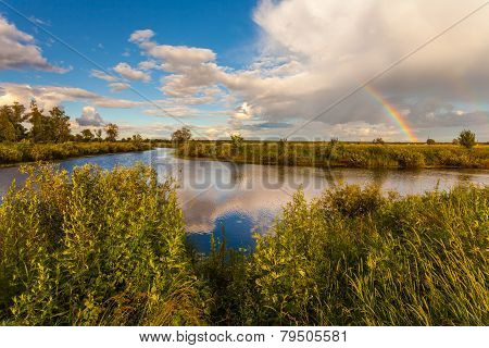 Colorful Ranibow Over The Falls And Water