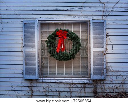 Traditional Xmas Wreath On Window