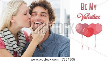 Woman kissing man on his cheek against cute valentines message