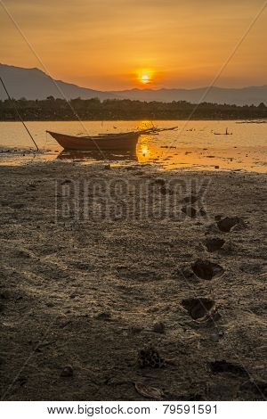 silhouette fishing boat and sunset