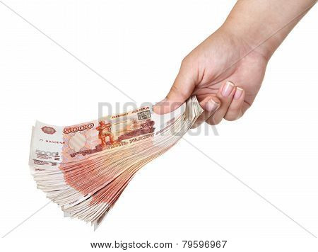 Stack of five thousandth bills in the female hand.