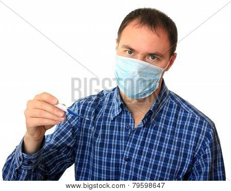 Man in a medical mask with a thermometer.