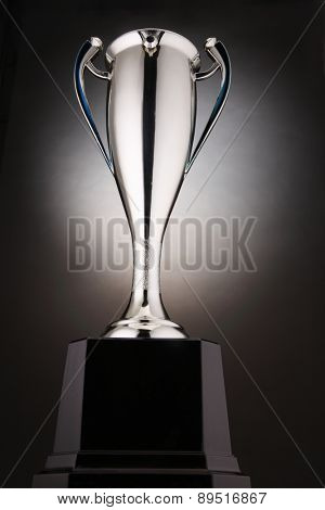 low angle of trophy with glow at the background