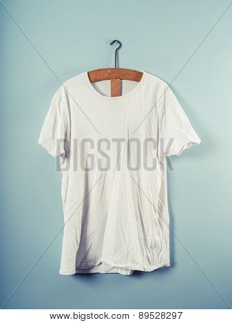 White T-shirt And Wooden Hanger