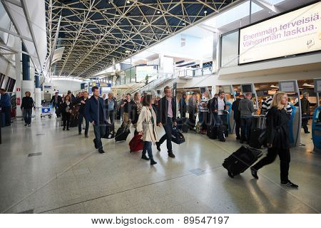 HELSINKI - SEP 03: passengers in Helsinki Airport on September 03, 2014 in Helsinki, Finland. Helsinki Airport  is the main international airport of the Helsinki metropolitan region