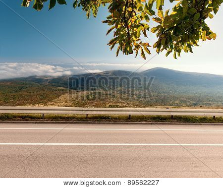 Side View Of Empty Highway In Mountain Area