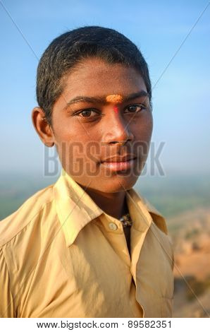 KAMALAPURAM, INDIA - 03 FEBRUARY: Young Indian pilgrim with bindi on hilltop