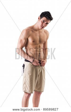 Handsome athletic shirtless young man isolated
