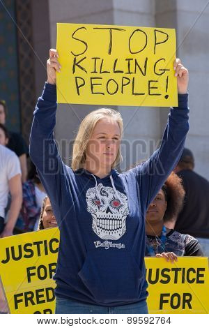 Woman Raising A Sign