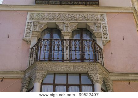 Moorish-style balconies, streets of the city Toledo, medieval architecture and Castilian