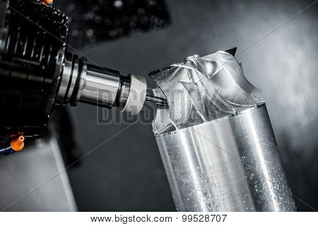 Metalworking CNC milling machine. Cutting metal modern processing technology. Small depth of field. Warning - authentic shooting in challenging conditions. A little bit grain and maybe blurred.