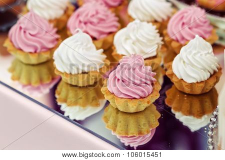 Cakes on a mirrored tray
