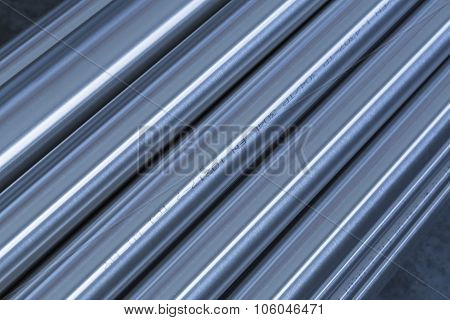 Stack of steel pipes, technical blue colored