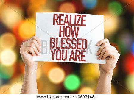 Realize How Blessed You Are placard with bokeh background