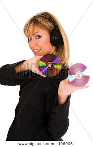 Woman Listening Music In Headphones And Holding Two Cd 