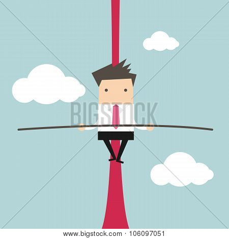Businessman balancing on rope