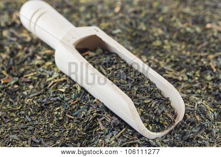 Green Tea Leaves And Wooden Scoop,selective Focus