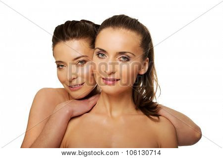 Two attractive sisters with make up.