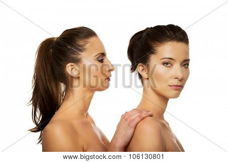 Beauty woman with make up standing behind her friend.