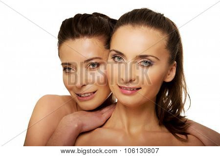 Two attractive sisters with make up.