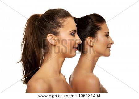 Two attractive sisters with make up.
