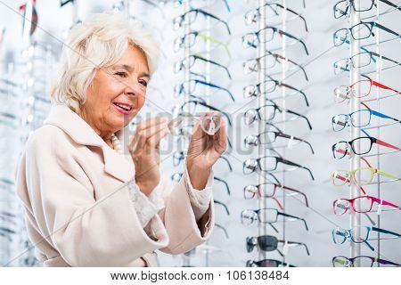 Choosing Glasses In Optician Store